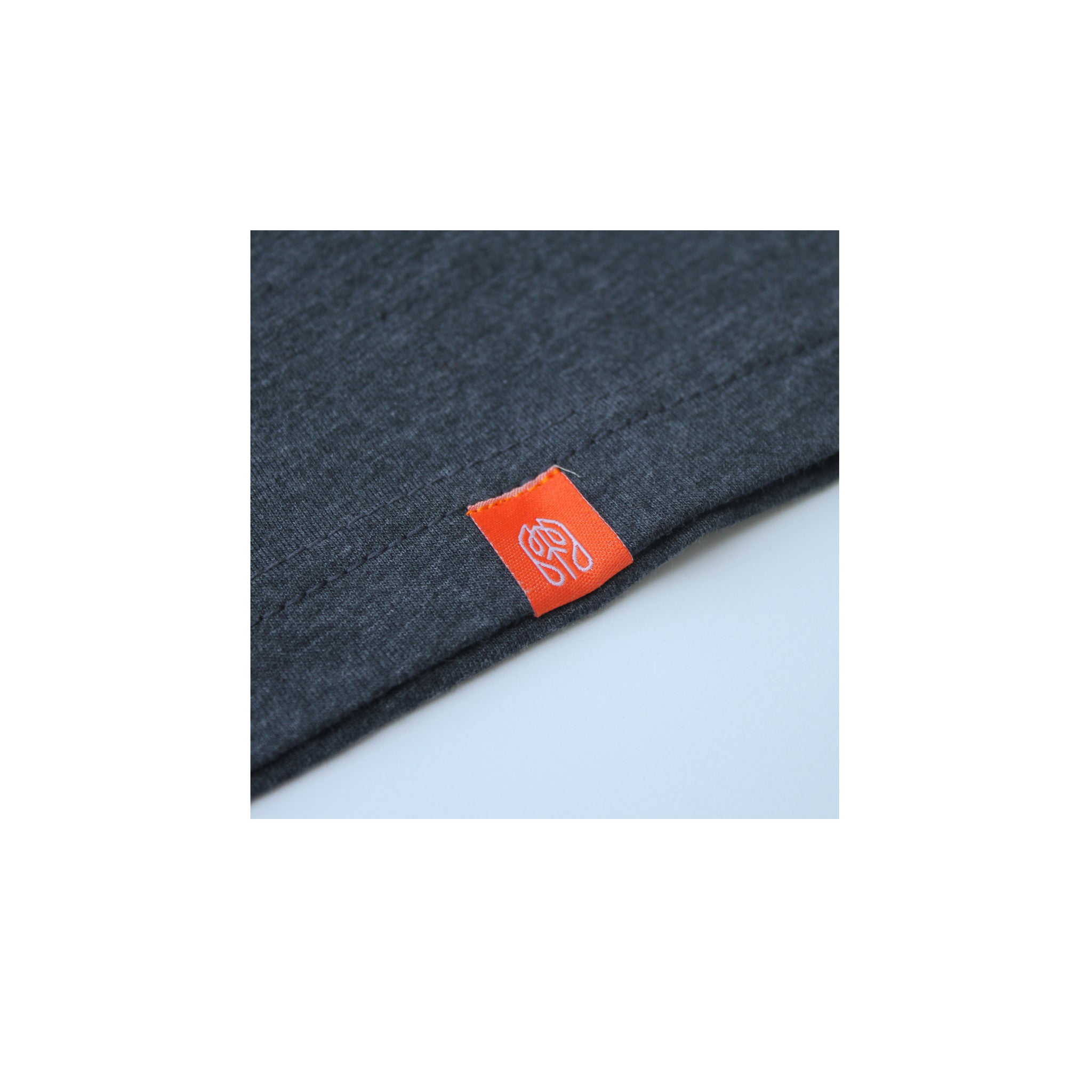 Charcoal - Common Ground T shirt Hem Tag View